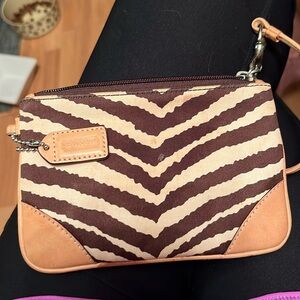 Wristlet coach animal print very good condition. With strap
